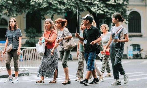A group of Spanish tourists are accompanied by a tour guide in Hanoi, Aug. 20, 2023. Photo by Nguyen Anh Tuan